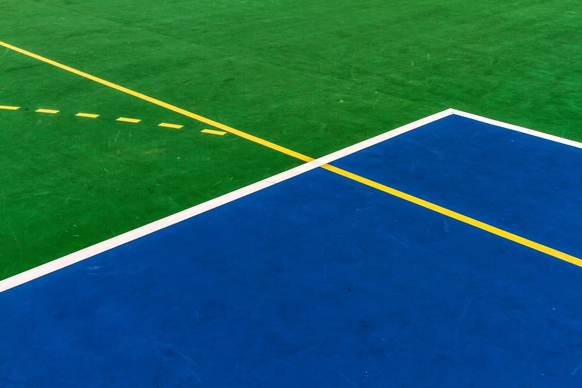 Abstract composition of blue, white, yellow and green forms representing the diverse AI landscape