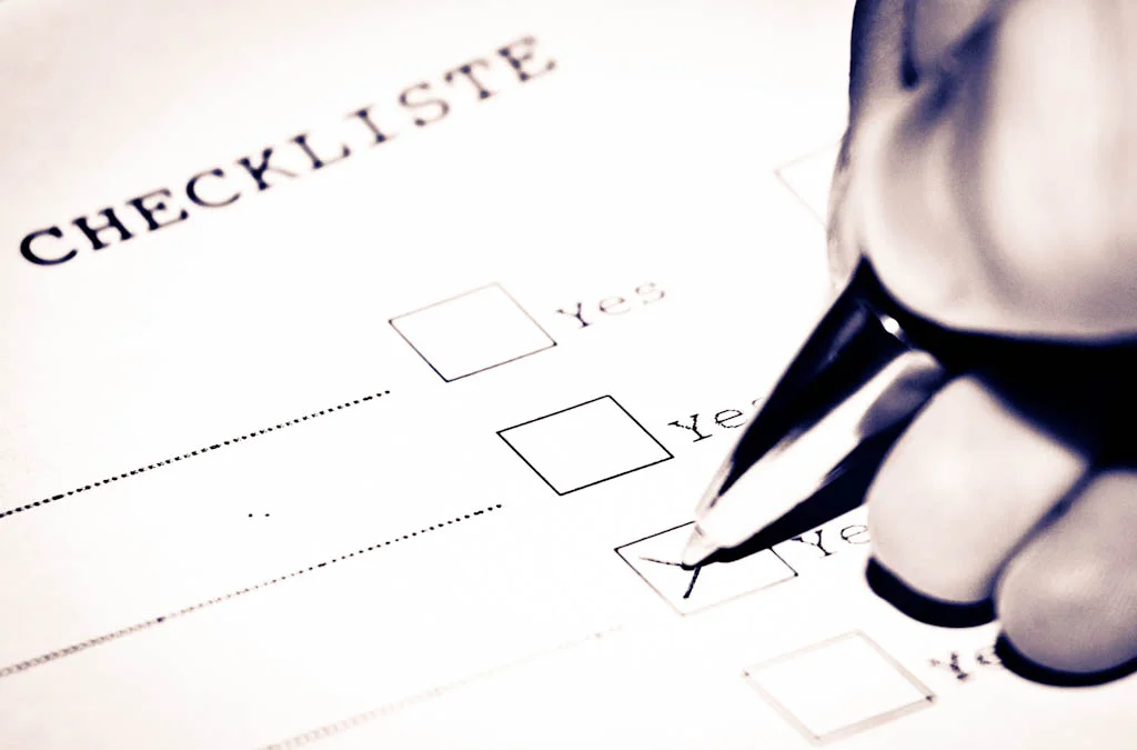 A handwritten checklist on a clipboard
